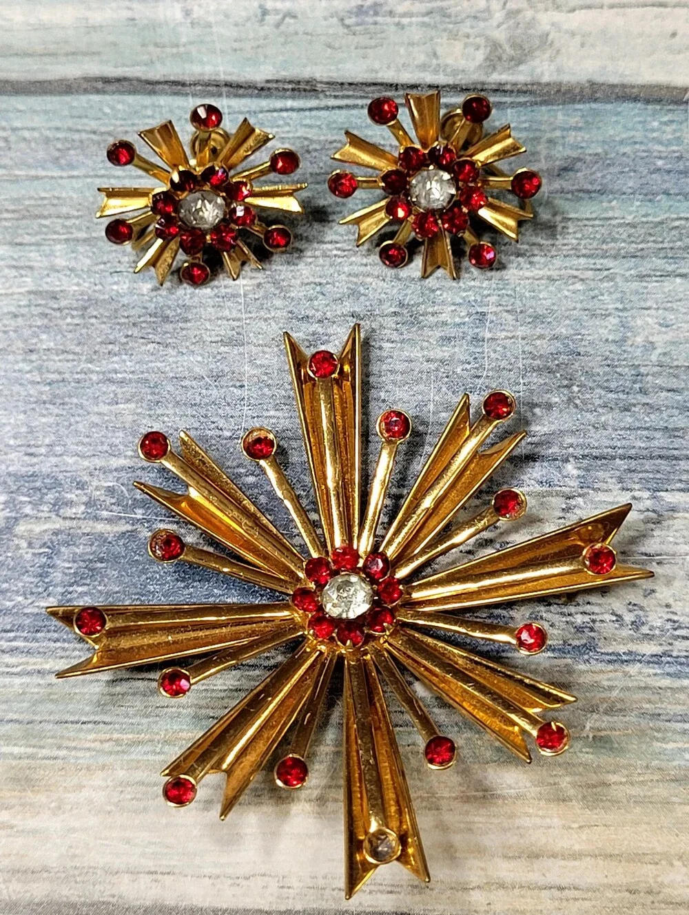 Gold Starburst Brooch and Earring Set with Red Rhinestones
